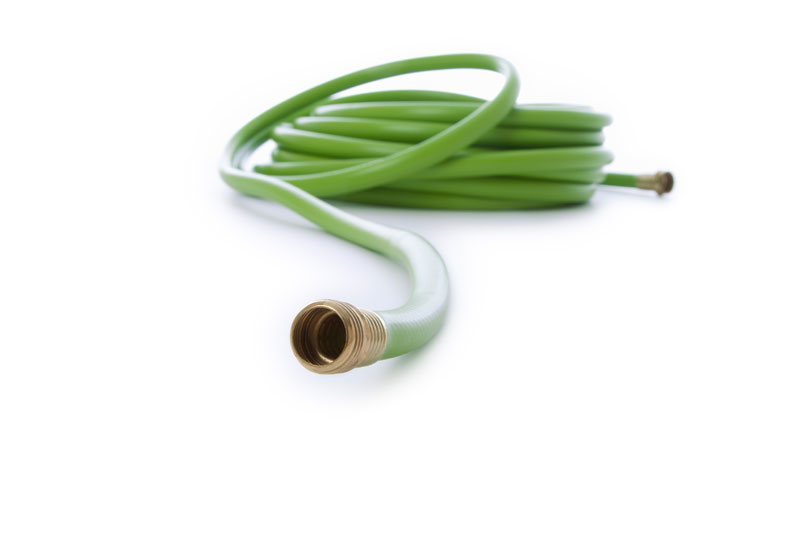 green-garden-hose-low-angle-isolated-on-white-back-2025-01-09-15-28-44-utc green garden hose