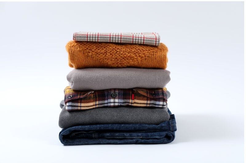 stack-of-winter-clothes-isolated-on-white-backgrou-2023-11-27-05-10-32-utc stack of clothes
