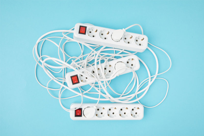 top-view-of-arrangement-of-extension-cords-isolate-2024-11-18-04-52-31-utc Electrical Cords and Cables