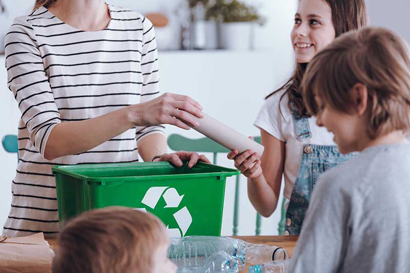 mother-teaching-kids-to-recycle mother-teaching-kids-to-recycle