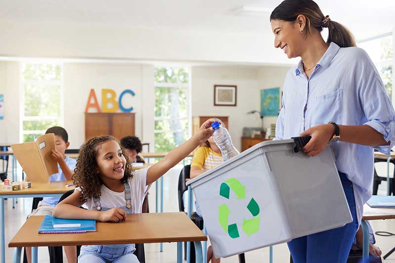 teacher and student recycling in class